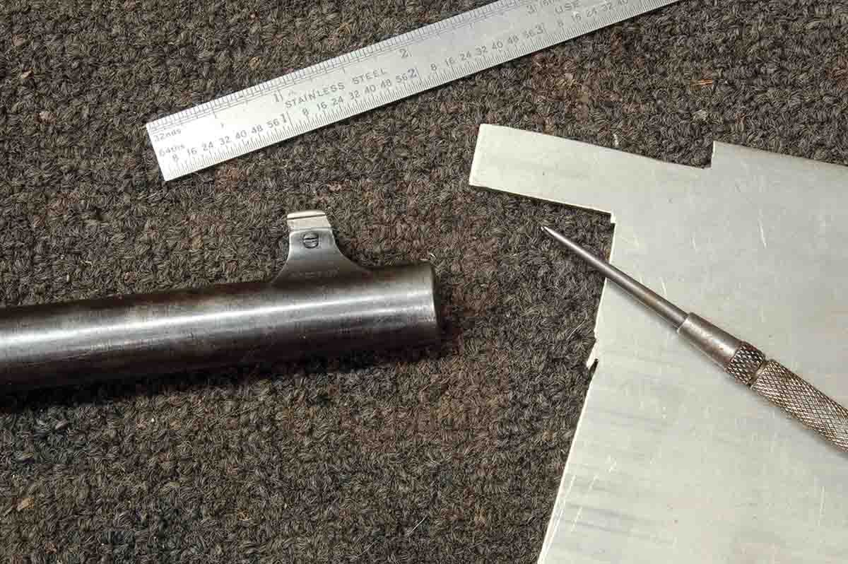 An original blade made from German silver sheet, which will be used to make a replacement blade as described.